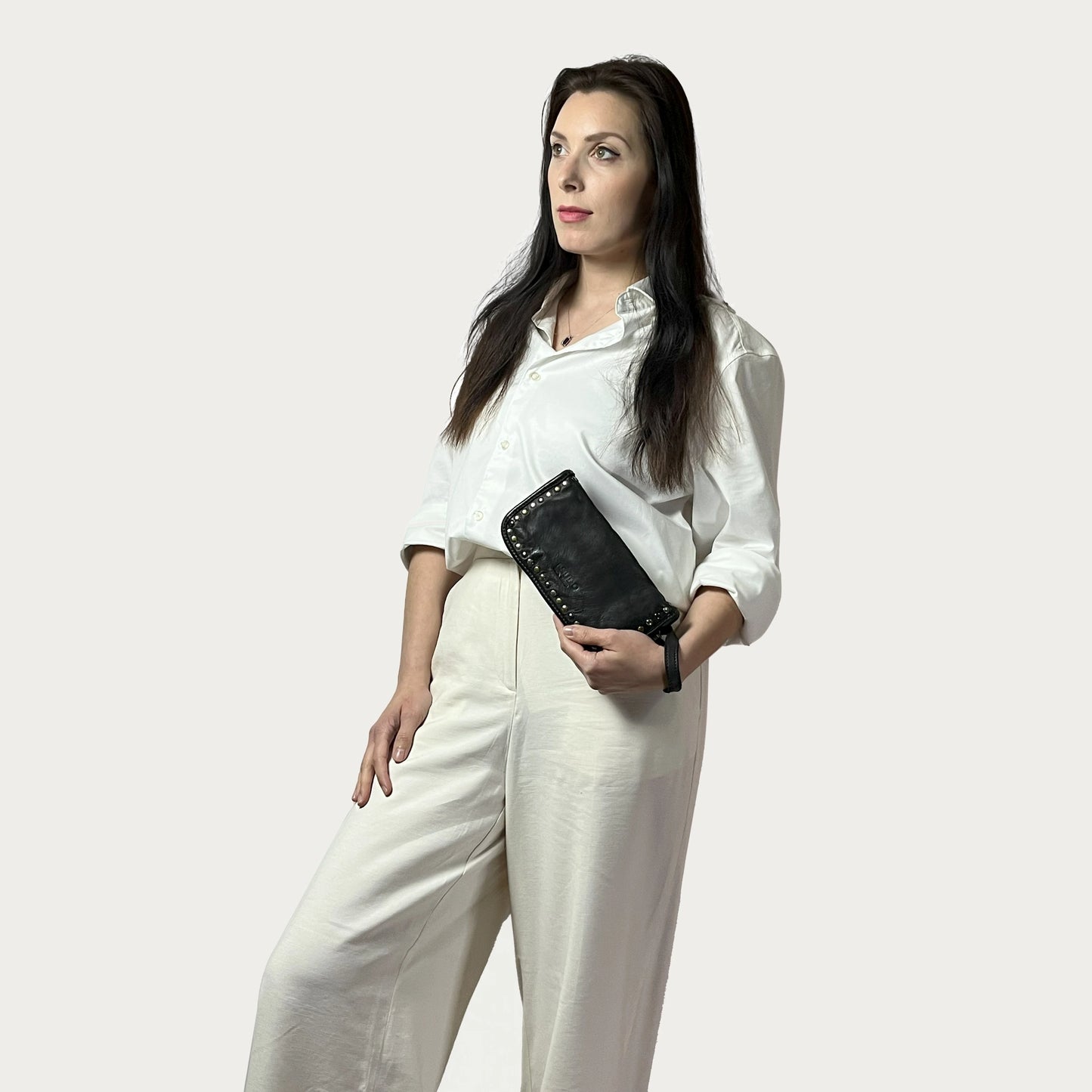 Black Italian leather wallet — Aurum style — lifestyle styling — Made in Tuscany