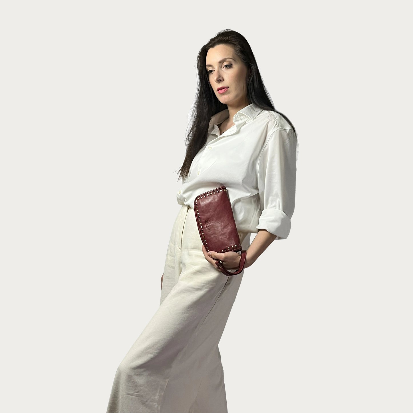 Wine Italian leather wallet — Aurum style — carried by model — Made in Tuscany