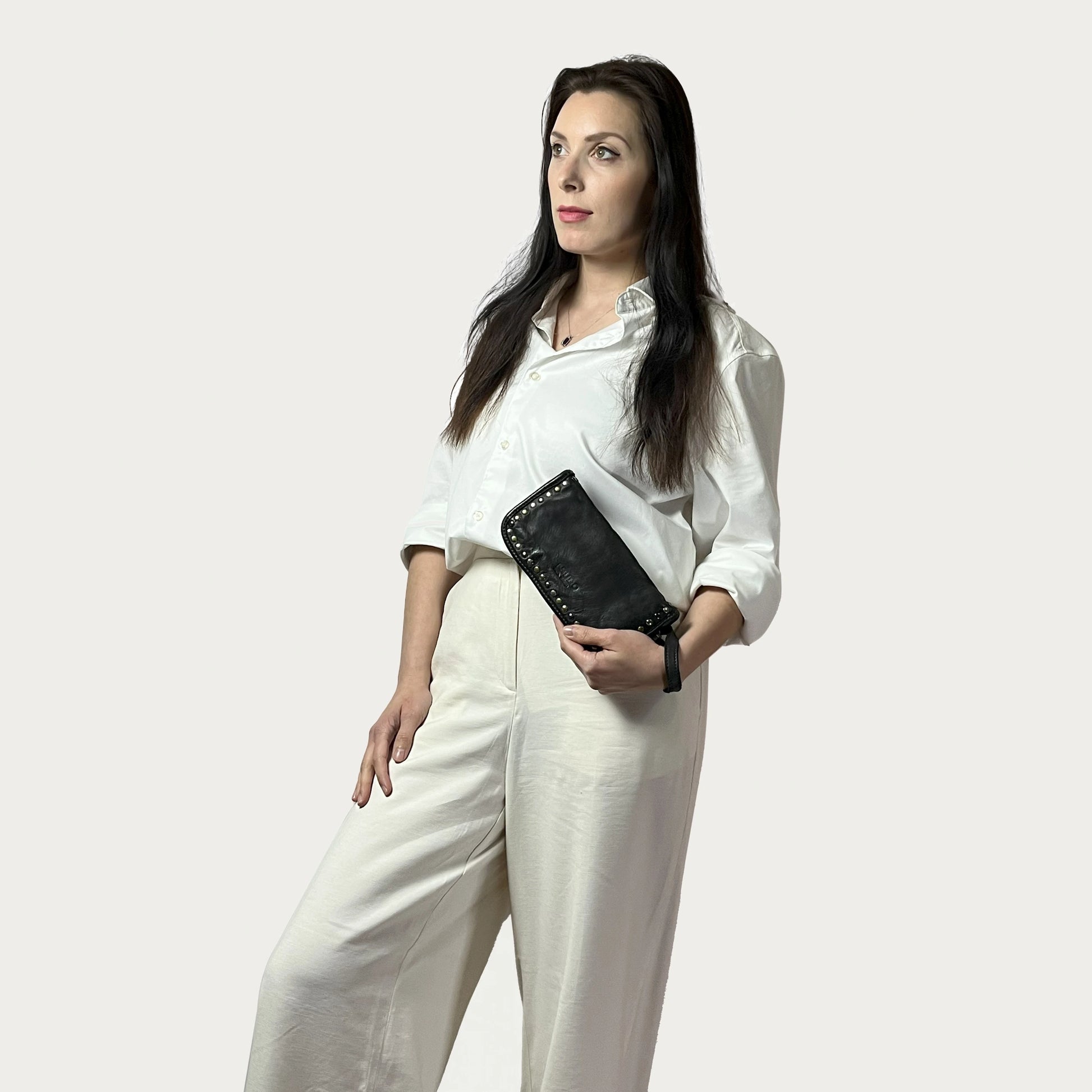 Black Italian leather wallet — Aurum style — lifestyle styling — Made in Tuscany