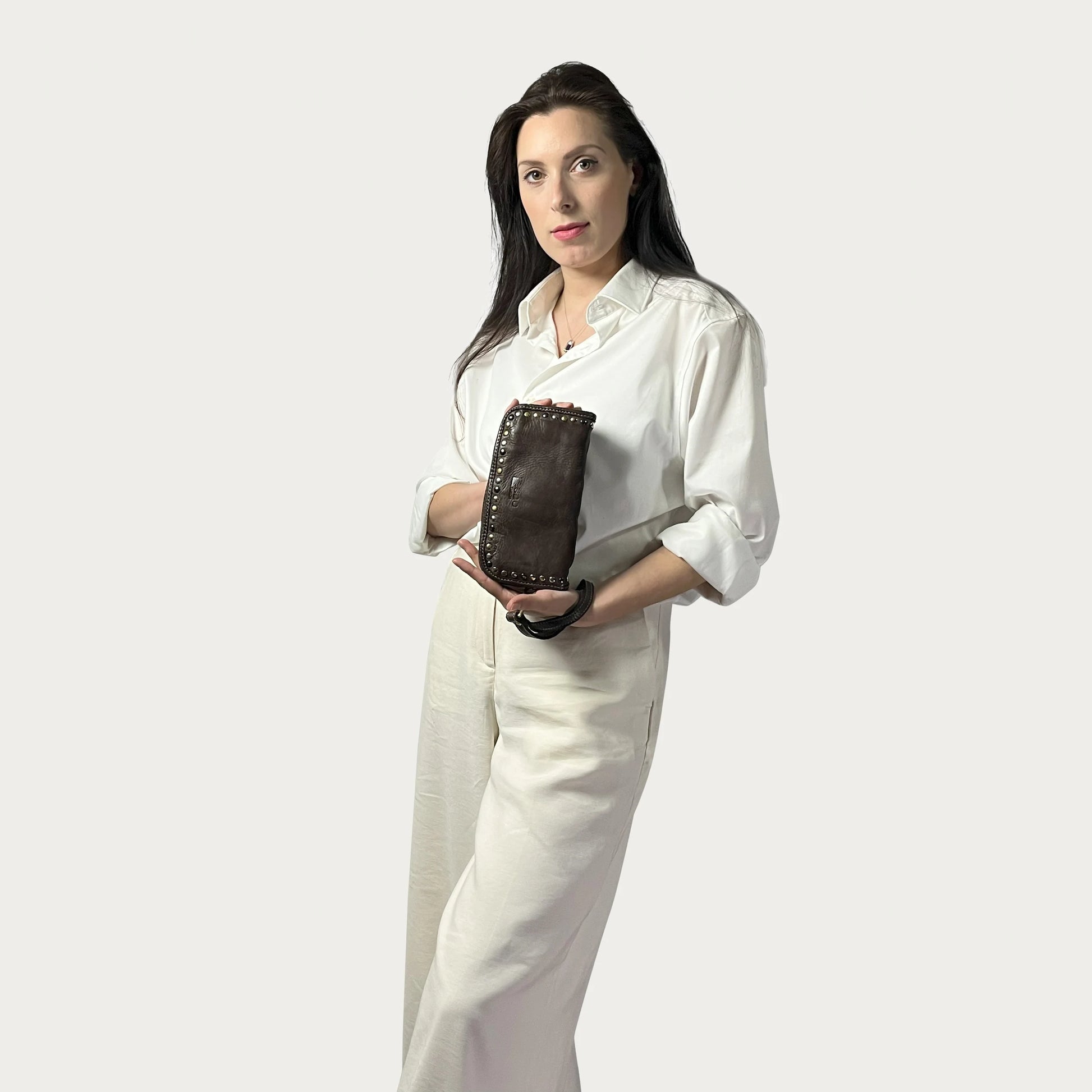 Brown Italian leather wallet — Aurum style — carried by model — Made in Tuscany