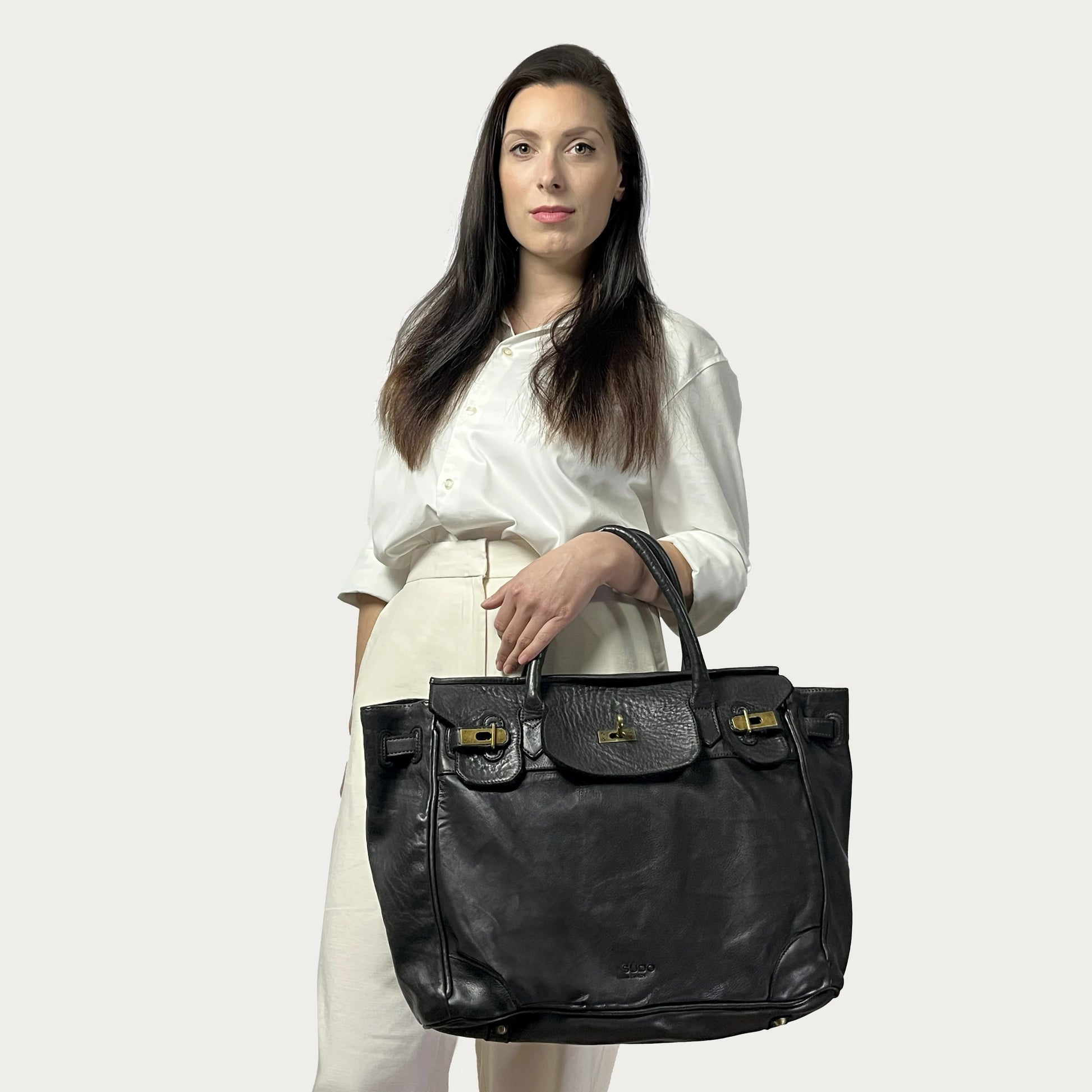 Black Italian leather tote — Heritage style — carried by model — Made in Tuscany