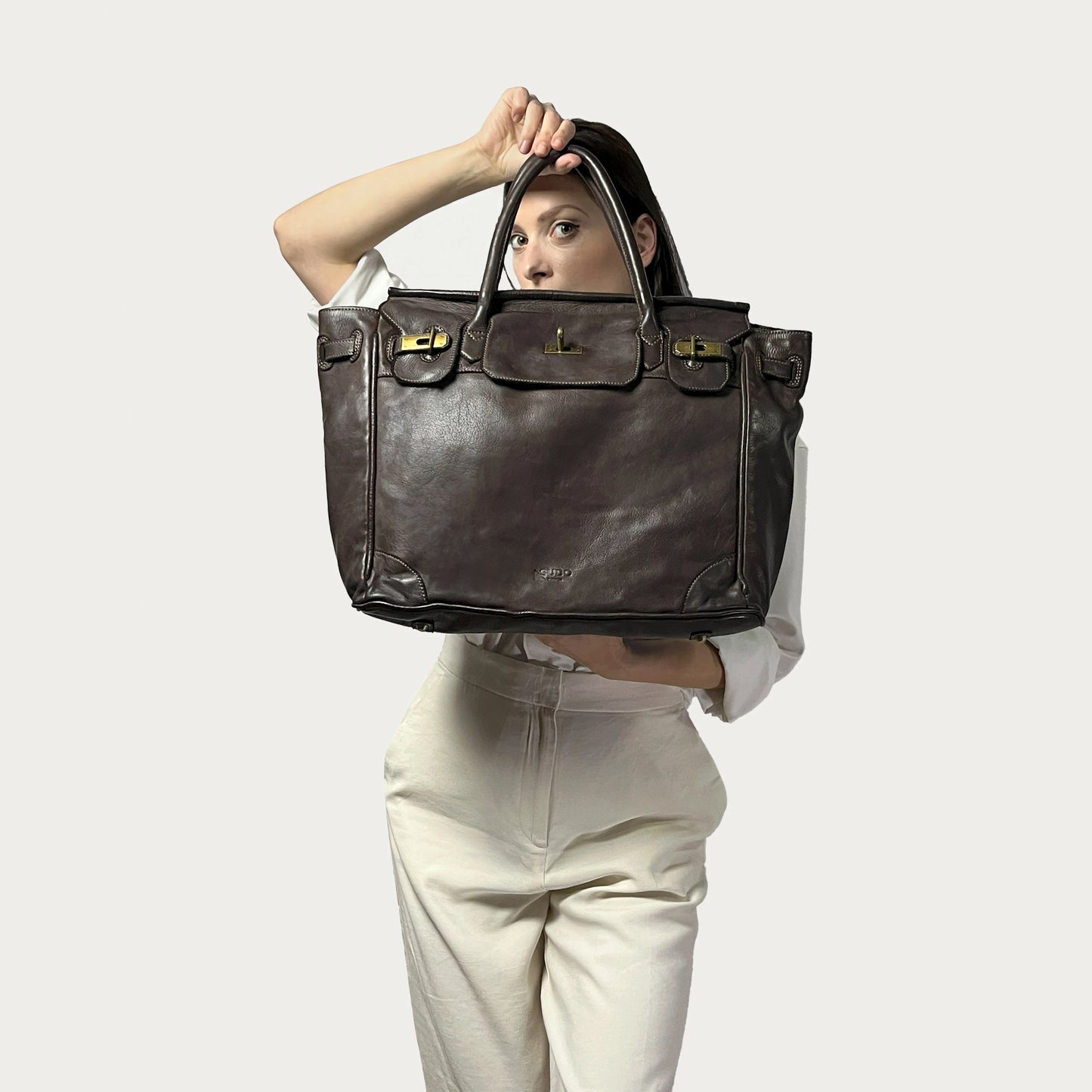 Brown Italian leather tote — Heritage style — carried by model — Made in Tuscany