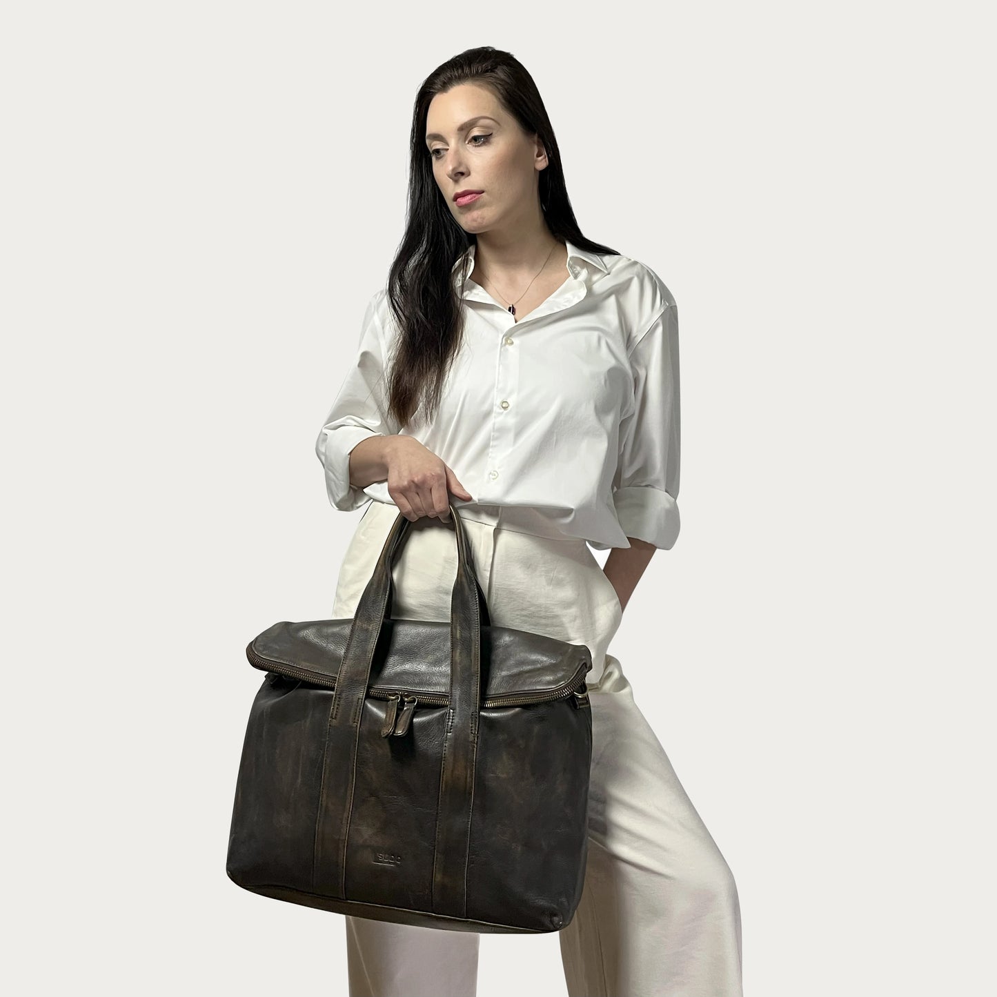 Brown Italian leather handbag — Journey style — carried by model — Made in Tuscany