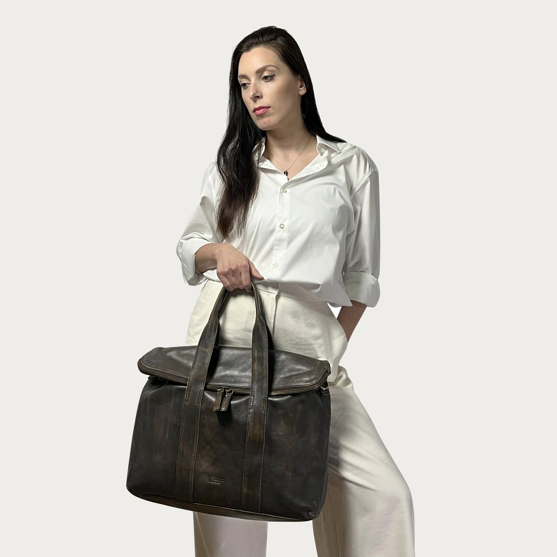 Brown Italian leather handbag — Journey style — carried by model — Made in Tuscany