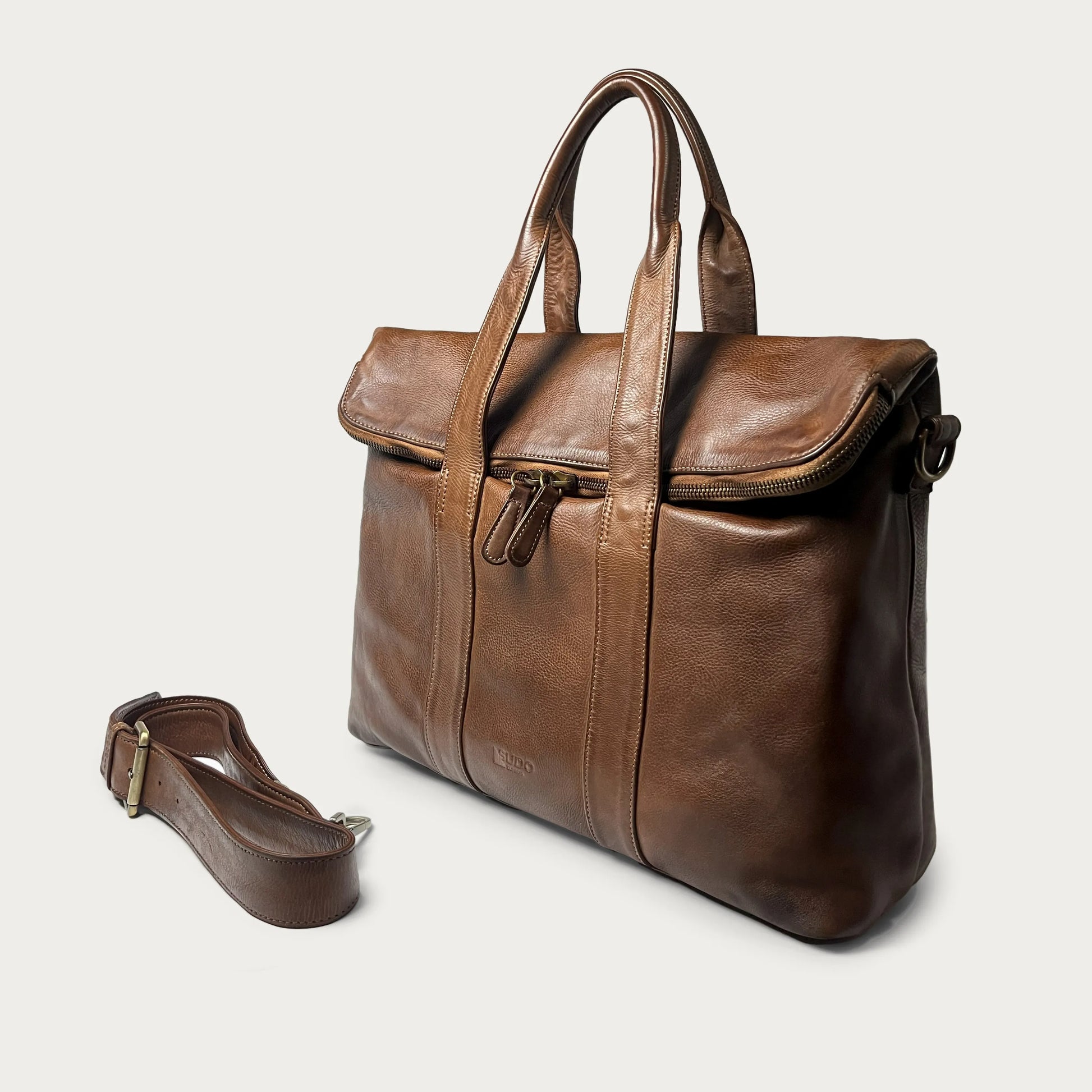 Cognac Italian leather handbag — Journey style — angled view with detachable strap — Made in Tuscany