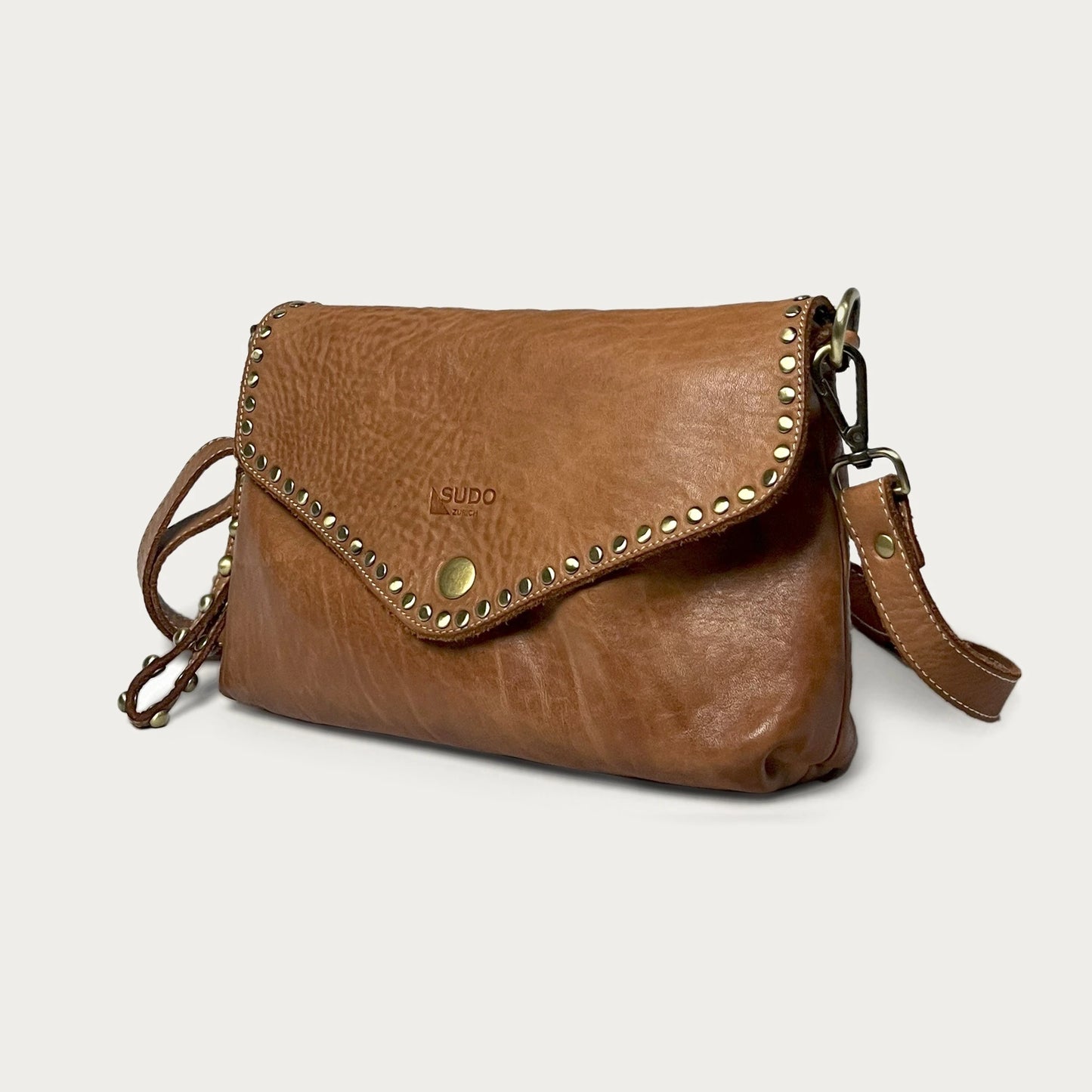 Cognac Italian leather pochette — Solstice style — angled view — Made in Tuscany