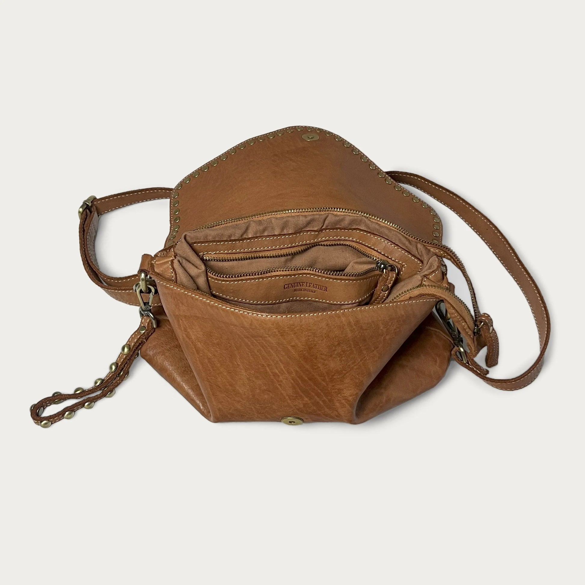 Cognac Italian leather pochette — Solstice style — open view showing interior — Made in Tuscany