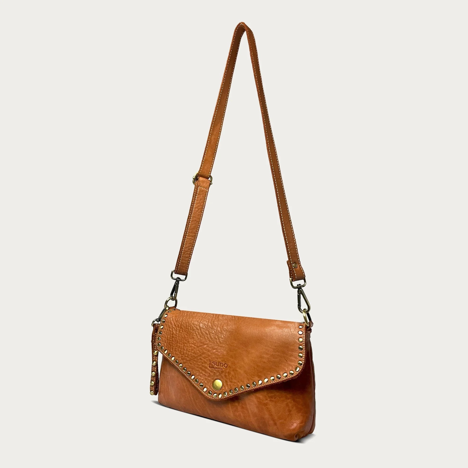 Cognac Italian leather pochette — Solstice style — strap detail — Made in Tuscany