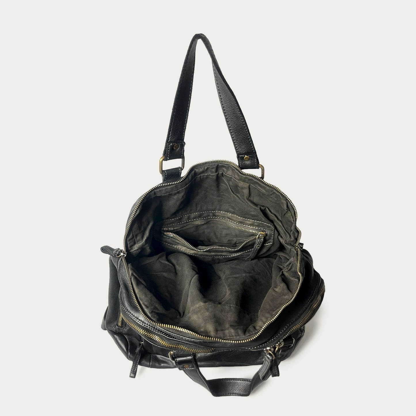 Black Italian leather backpack — Voyage style — open view showing interior — Made in Tuscany