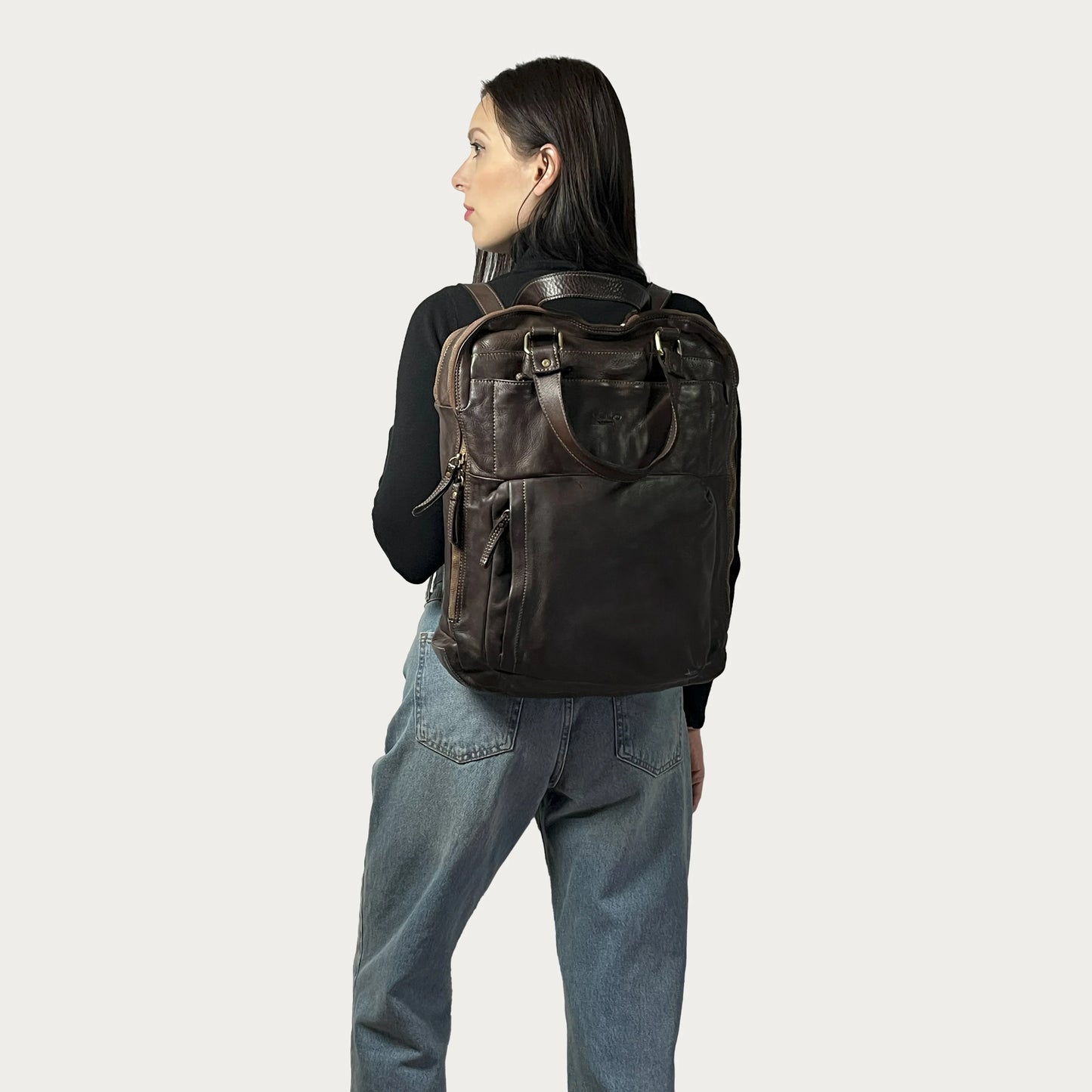 Brown Italian leather backpack — Voyage style — carried by model — Made in Tuscany