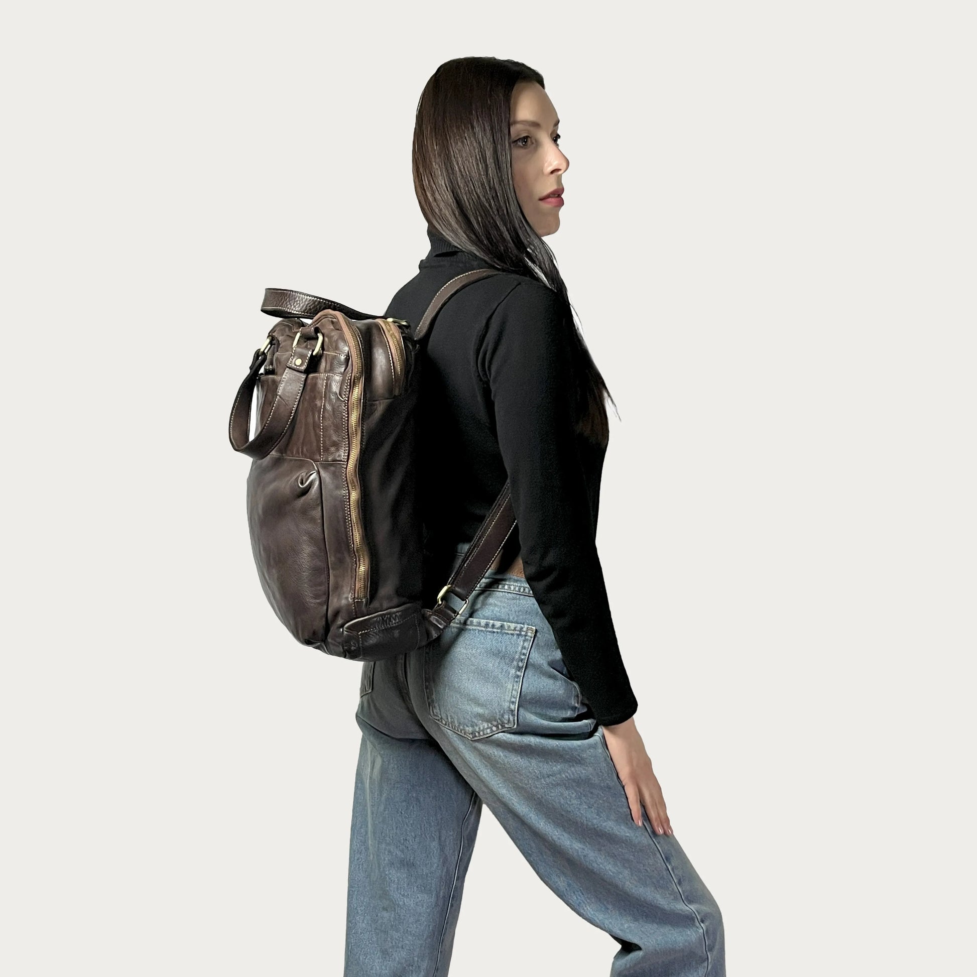 Brown Italian leather backpack — Voyage style — carried by model — Made in Tuscany