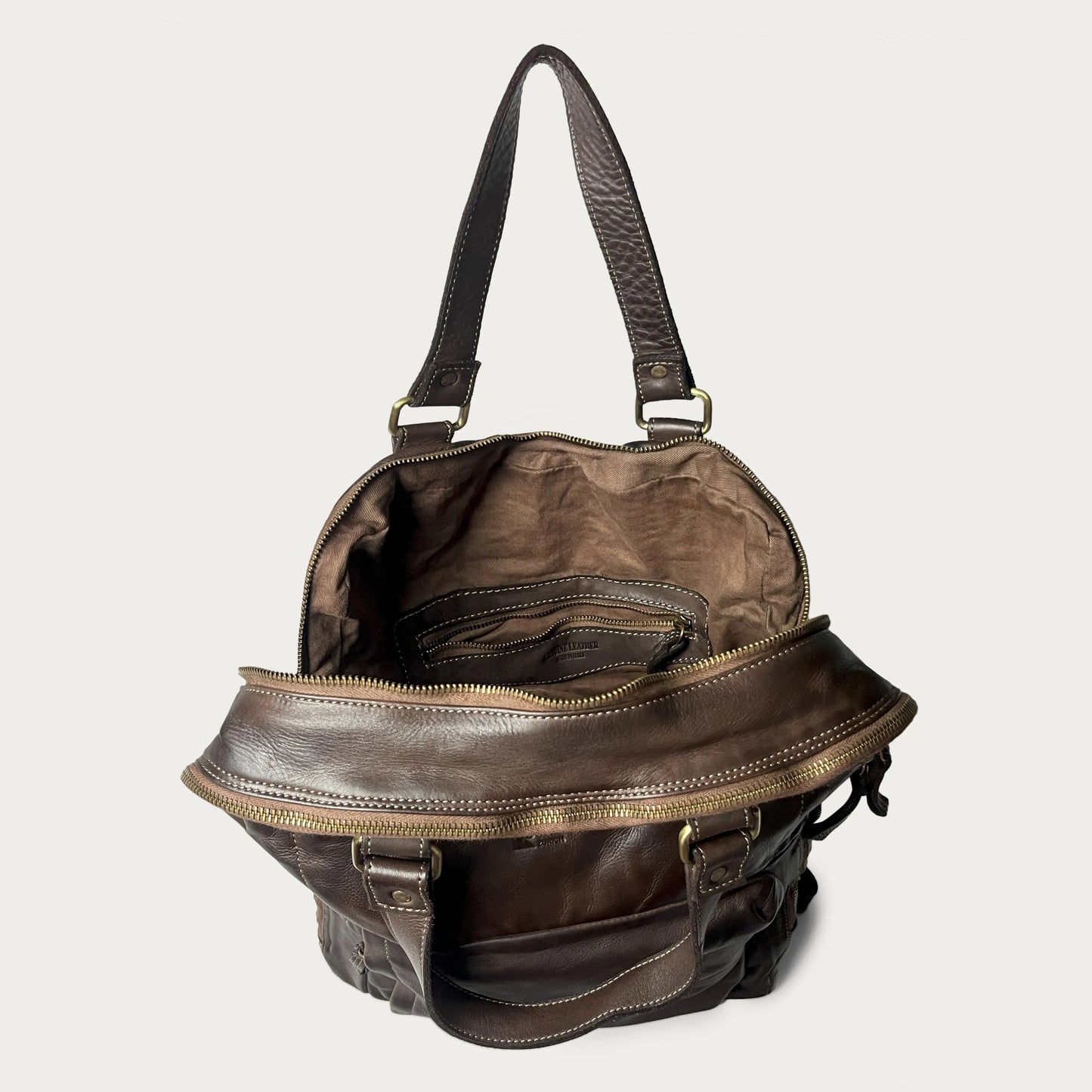 Brown Italian leather backpack — Voyage style — open view showing interior — Made in Tuscany