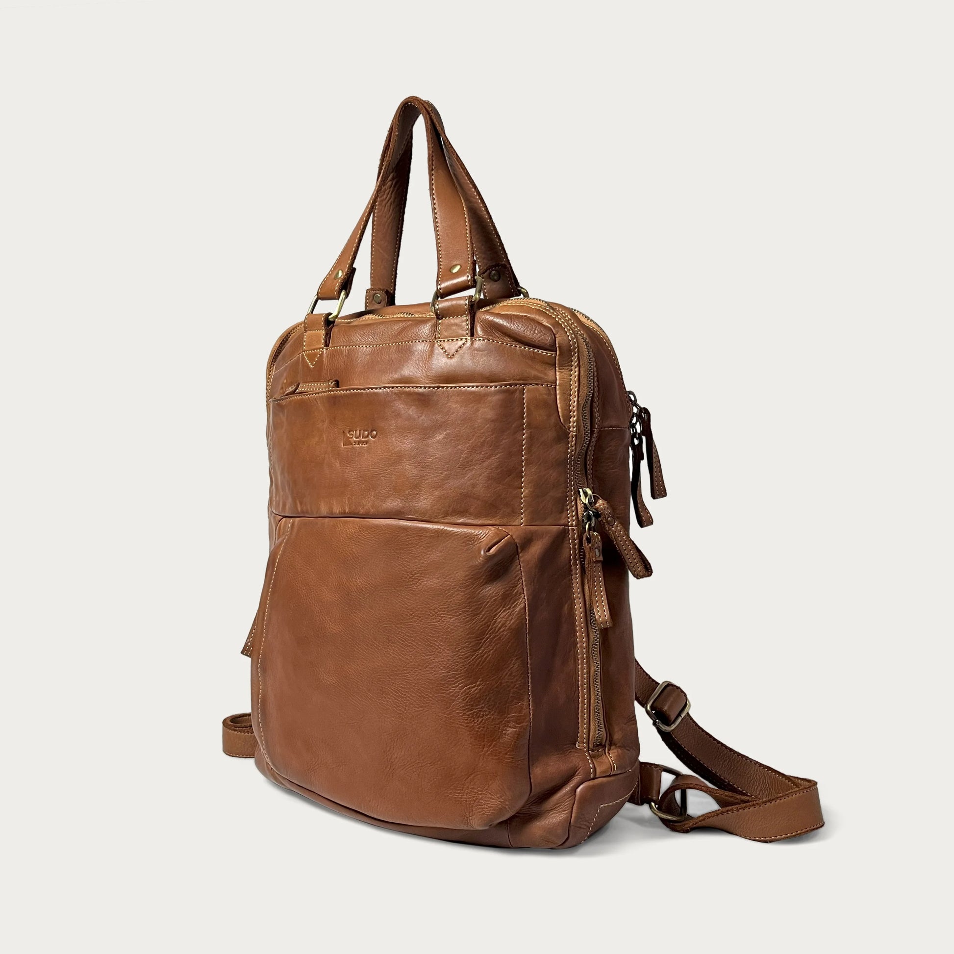 Cognac Italian leather backpack — Voyage style — angled view — Made in Tuscany