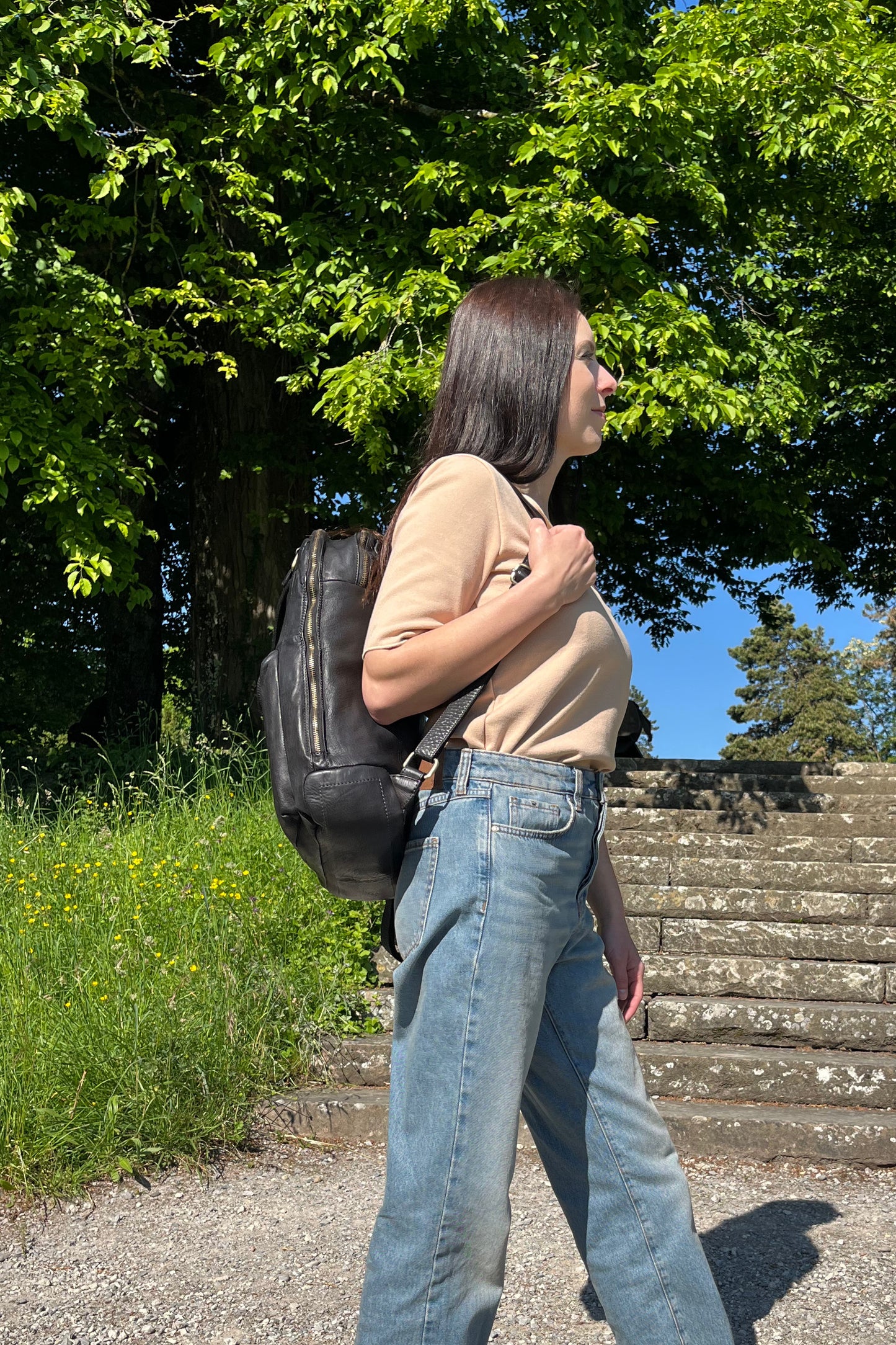 Black Italian leather backpack — Voyage style — lifestyle styling — Made in Tuscany